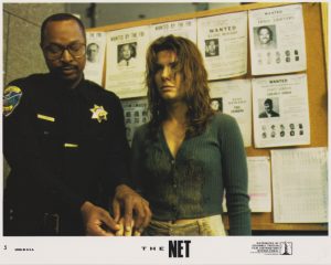 Angela Bennett (Sandra Bullock) at the police station