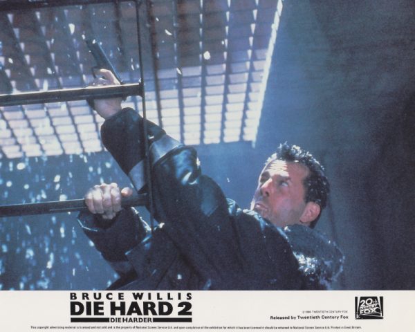 McClane desperately attempts to open an iron grate