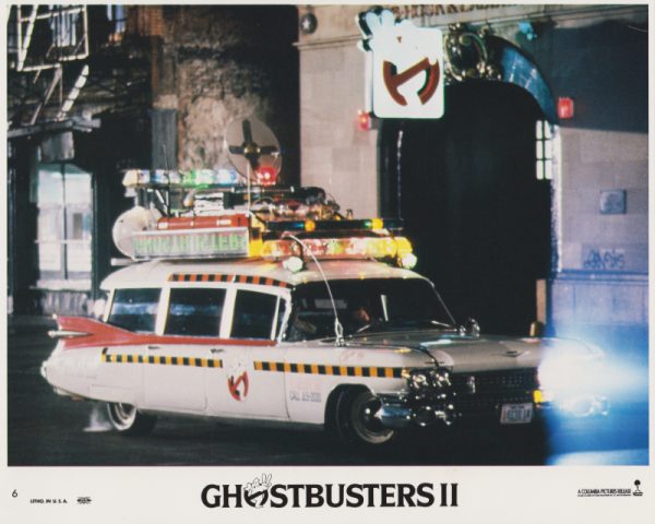 Card #06: The iconic "Ecto-1" Ghostbusters vehicle in action!