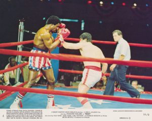 Card #04: An action shot from the epic boxing match between Creed and Balboa