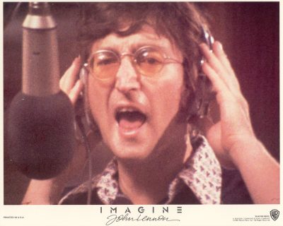John Lennon at the microphone in a recording studio
