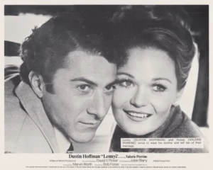 A vintage cinema lobby card showing Dustin Hoffman with Valerie Perrine in "Lenny" (1974)