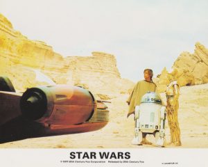 Mark Hamill as Luke Skywalker, alongside R2-DC and C-3PO