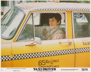 A vintage Taxi Driver lobby card featuring Robert De Niro