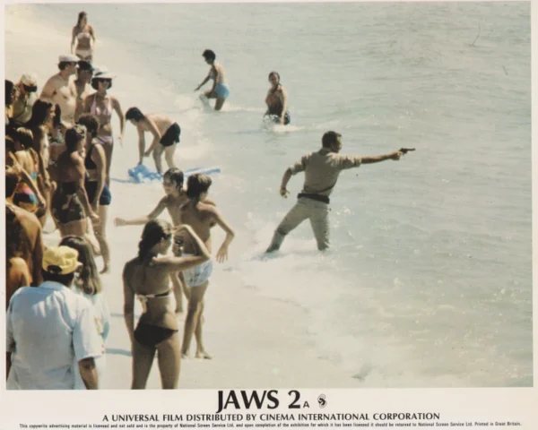 Chief Brody fires his revolver into the ocean