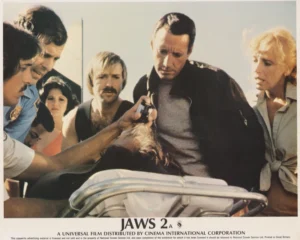 Chief Martin Brody checks on an injured civilian in Jaws 2 (1978)
