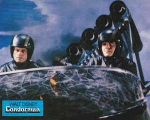 Oliver Reed (left) in a scene from "Condorman" (1981) [scanned-in image]