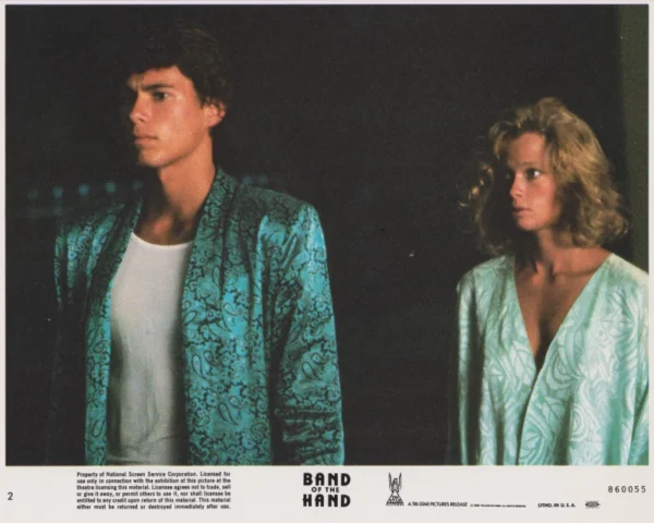 Lauren Holly (right) in a scene from Band of the Hand (1986)
