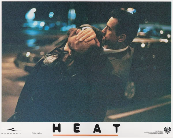 Waingro (Kevin Gage) is held by Neil McCauley (Robert De Niro)