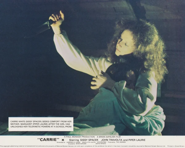 Carrie White (Sissy Spacek) seeks comfort from her mother, Margaret (Piper Laurie)