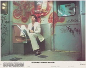 John Travolta starring in Saturday Night Fever (1977) [US cinema lobby card]
